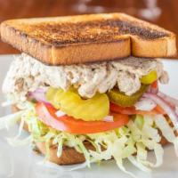 Tuna Sub Sandwich · Mayo, mustard, lettuce, tomato, onion pickles, banana peppers, and jalapeños.