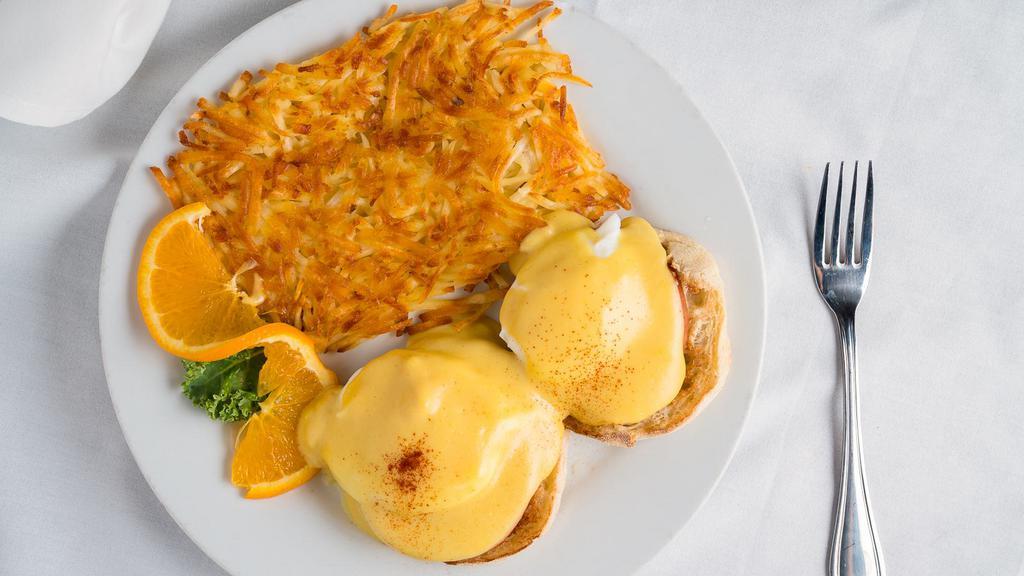 Eggs Benedict · Poached eggs on toasted English muffins with Canadian bacon, topped with hollandaise sauce.