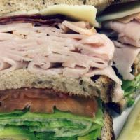 Smoked Turkey Club · Smoked turkey with turkey bacon, avocado, lettuce, tomato and swiss cheese on your choice of...