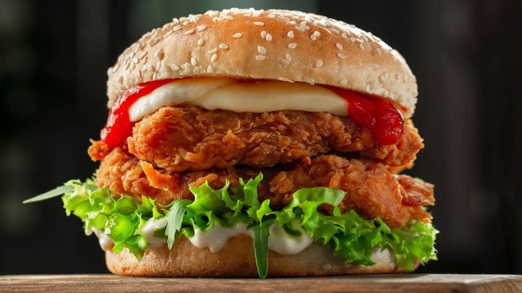 Fried Cheese Chicken Sandwich · Chicharron crusted, delicious fried chicken with jack cheese on a sandwich with spicy aioli and turmeric dill pickles.