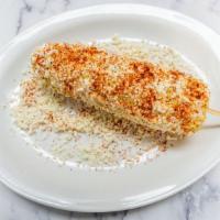 Elote · Gluten-Free. Charbroiled street corn, topped with mayonnaise and rolled in Queso Fresco and ...