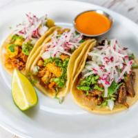 Street Taco Trio · Gluten-Free. Your choice of meat topped with white onion, cilantro, and radish.