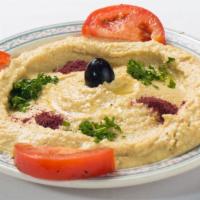 Hummus · Garbanzo bean spread mixed with tahini, garlic lemon, and olive oil.