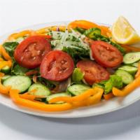 Garden Salad · Romaine lettuce, tomatoes, green pepper, cucumbers, carrots, red cabbage, and fresh onion.