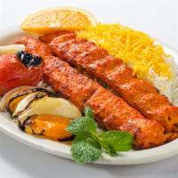Chicken Koobideh · Two lean ground chicken skewers, charbroiled over an open flame.