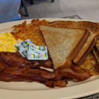Breakfast Plate · Two eggs any style, hash browns, toast and choice of ham, bacon, or sausage links.