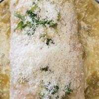 El Dorado Burrito · pork chorizo, scrambled eggs, potatoes and tomato with salsa verde jack and cotija cheese on...