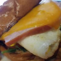 Bacon Egg And Cheddar Sandwich · two fried eggs with cheddar, bacon, arugula, tomato and mayo