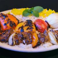 7- Shish Kabob · Chunks of marinated beef tenderloin cooked over open fire. Served with basmati rice, Salad, ...