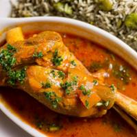 35- Baghali Polo (With Lamb) · Lamb shank served with dill basmati rice and java beans.
