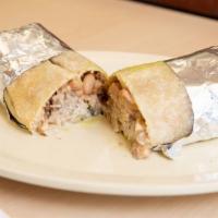 Super Burrito · Rice, beans, pico de gallo, cheese, guacamole, sour cream and your choice of meat.