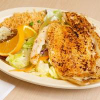 Fish Fillet Plate · Refried beans, rice, lettuce, guacamole, sour cream and your choice of meat, and side of tor...