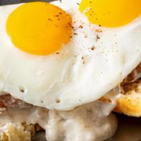 Country Breakfast · Fresh hot biscuit, sausage patties, and country gravy topped with two eggs.