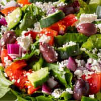 Mediterranean Salata · Diced tomatoes, cucumber, sweet red onions, Kalamata olives, and feta cheese over a bed of c...