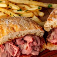 French Dip · Slow roasted Certified Angus Beef on a grilled Ciabatta roll. Served with au jus and your ch...