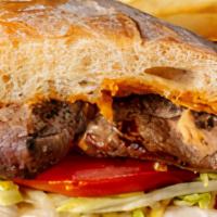 Buffalo Bob'S Steak Sandwich · 6-ounces of CERTIFIED ANGUS BEEF on a grilled sourdough roll with lettuce, tomato, and our s...
