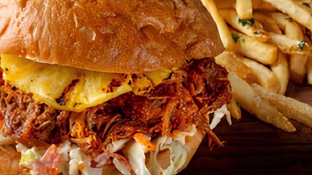 Hawaiian Pulled Pork Sandwich · Our slow-cooked pulled pork with BBQ sauce served on our Ciabatta bun with crispy coleslaw and fresh pineapple.