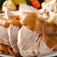 Fresh Roasted Turkey Dinner · Carved turkey breast served over our delicious stuffing with your choice of side (Served bes...