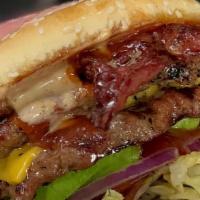 Double Bacon Super Burger · Double 1/4-pound burger, Bacon with lettuce, tomato, onion, pickle, and house sauce 

Med Fr...