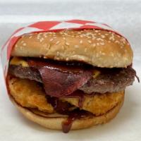 Western Burger · 1/4 lb Burger Patty, Bacon,  2 Onion rings and BBQ sauce.