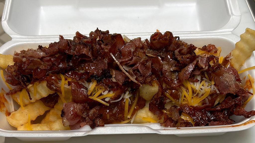 Chilli Cheese Pastrami Fries · Deep- fried crinkle cut fries topped with hot chilli, cheese, and pastrami