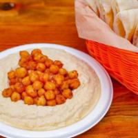 Hummus Middle Eastern Beans · Vegan, gluten-free. Homemade hummus topped with hot slow cooked Middle Eastern beans. Served...