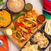 Family Meal #1 · 2 lbs. fajitas, beef or chicken. Served with large rice, large beans, tortillas, chips and s...