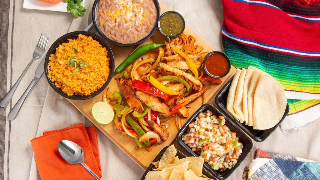 Family Meal #1 · 2 lbs. fajitas, beef or chicken. Served with large rice, large beans, tortillas, chips and salsa.