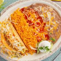 Taco And Enchilada Combo · Two hard tacos of beef or chicken and one cheese enchilada.
