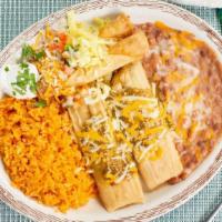 Tamales And Taquitos Combo · Two chicken tamales and two shredded beef taquitos.