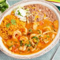 Camarones Rancheros · Juicy shrimp with sliced onions and tomatoes, served with rice, beans, sour cream and guacam...