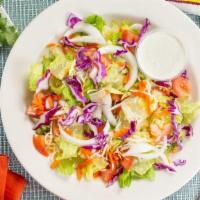 Garden Salad · Lettuce, tomatoes, onions, red cabbage, carrots, and cheese.