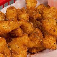 Popcorn Shrimp · Crispy batter shrimps w/ cajun seasoning.
