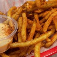 Cajun Fries · Crispy coated skinny cajun seasoning french fries.