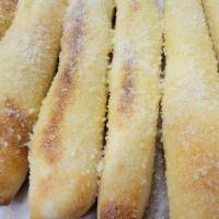 Fred Bread™ · 8 of aur famous bread sticks seasoned with garlic butter and parmesan cheese. comes with 1 d...