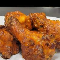 Wings (10) · 10'  Pieces of Wings with choice of : Spicy Buffalo Sauce, Honey BBQ , Nashville National Ho...