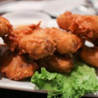 Golden Wings · Deep-fried chicken wings marinated and seasoned with house spices.