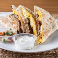 Breakfast Quesadilla · Vegetarian. Eggs, choice of bacon, ham or sausage. Monterey jack and cheddar cheese mix, pic...