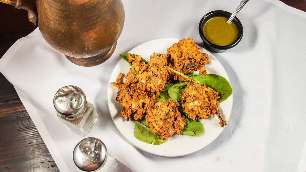 #2. Vegetable Pakora (5 Pieces) · Onion, spinach and cabbage cooked with Himalayan spices and herbs. Served with mint chutney.