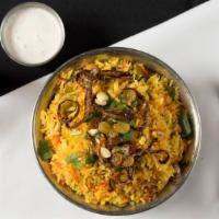 Vegetable Biryani · Mixed vegetables and homemade cheese cooked together with basmati rice and Himalayan spices.