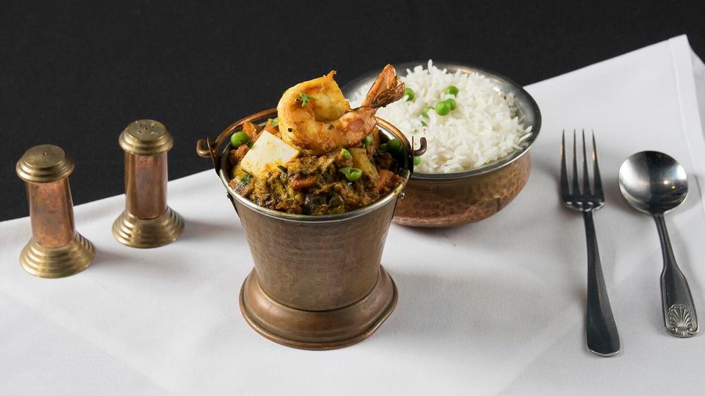 Himalayan Balti · Assorted pieces of tandoor cooked chicken breast, lamb, shrimp, and mixed vegetables prepared in especial sauce with different herbs and spices.
