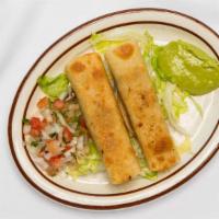 Taquitos (2 Pcs.) · Served with rice, beans, and guacamole.