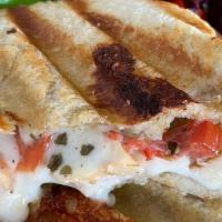 Chicken Pesto Panini · Mozzarella, onions, tomatoes, and pesto mayo on sourdough with a side of salad and a side of...