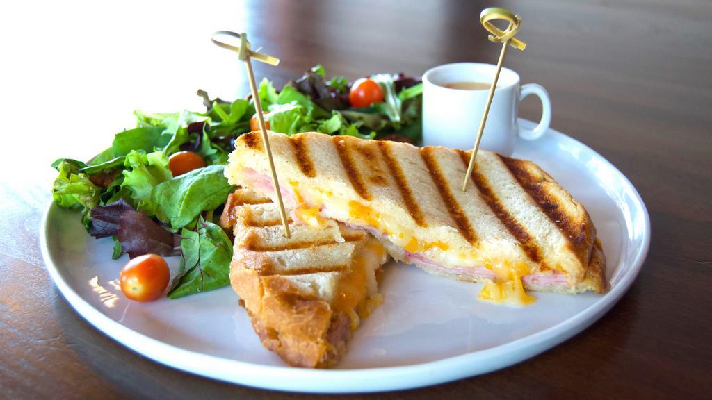 Ham And Cheese Panini · Ham and mozzarella on sourdough with a side of salad and a side of dressing
