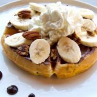 Nutella Pecan Banana Waffle · Nutella, pecans, banana, whipped cream, and powdered sugar