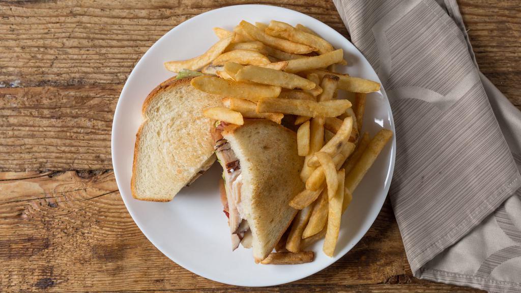 Turkey Club · Sliced turkey, bacon, avocado, lettuce, tomato, mozzarella cheese and mayo.