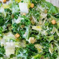 Brutes Caesar · Kale, shaved brussels sprouts and romaine lettuce, shredded parmesan, house made spicy roast...
