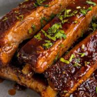 Family Full Rack Of Ribs · Family Meal - Full Rack of Ribs.  Comes with 2 side choices & half baguette.