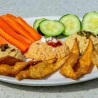 Hummus  Trio · Roasted Red Pepper, South-Western, and Roasted Garlic Hummus. Served with homemade herb chip...