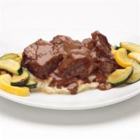 Beer-Braised Short Ribs · McGarvey’s Scottish Ale braised short ribs served with homemade roasted garlic mashed potato...